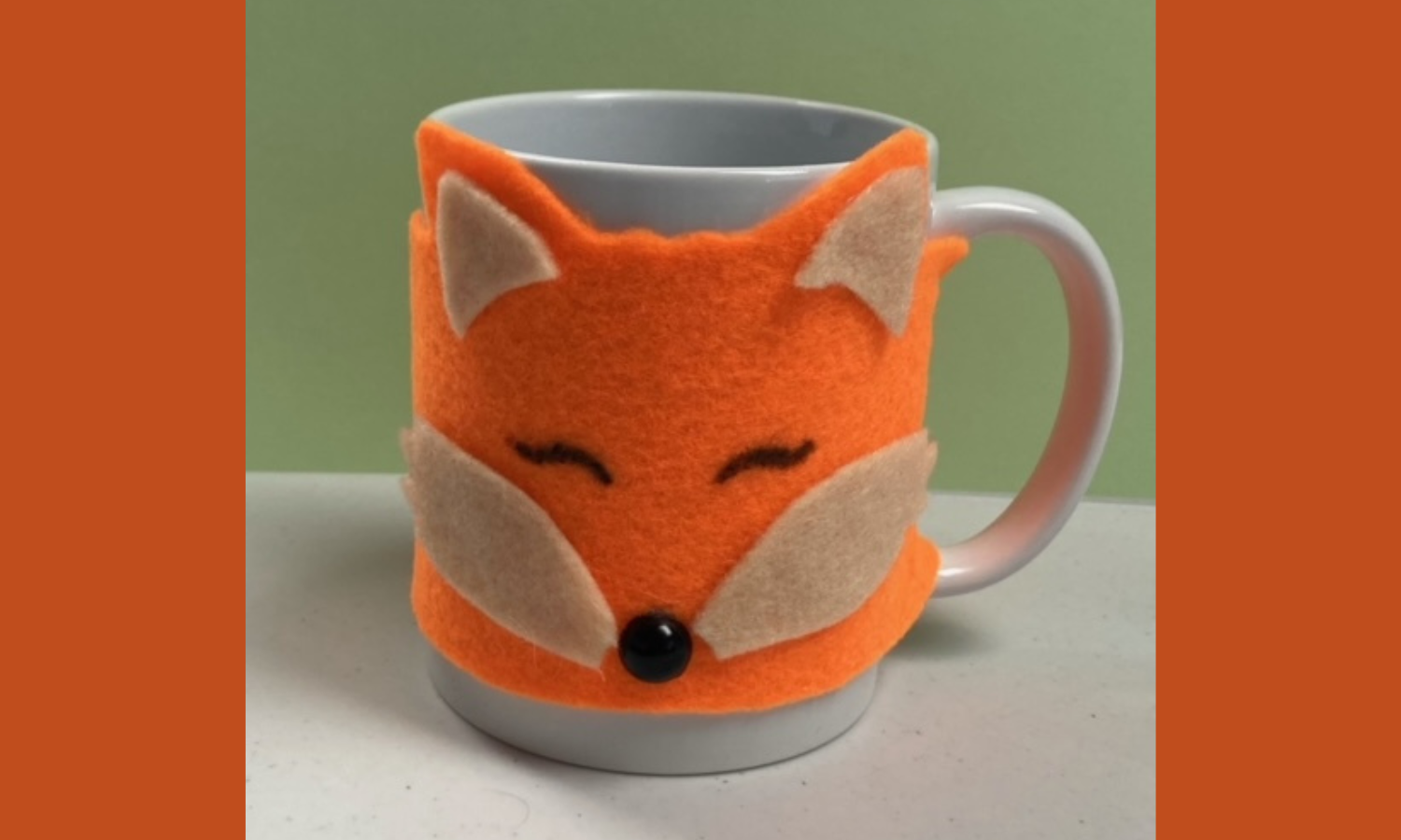 A mug covered in a felt fox face!